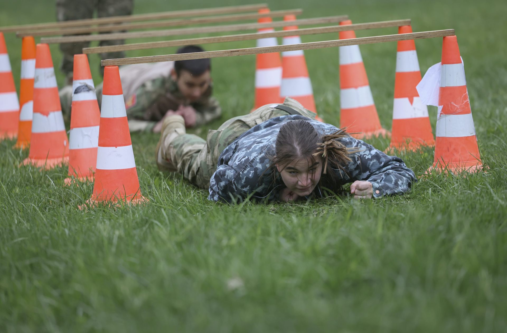 Members of the Yunarmiya, dressed in camouflage outfits, take part in a military training exercise.