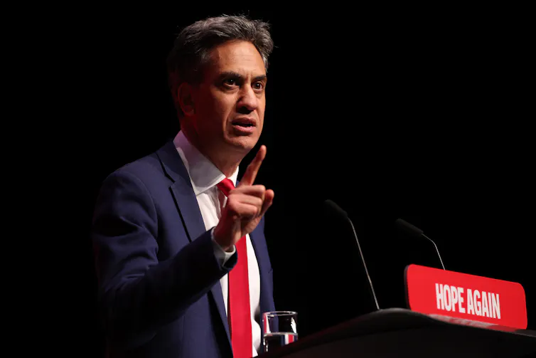 ed miliband at a lectern with hope again branding on it at the 2026 labour party conference