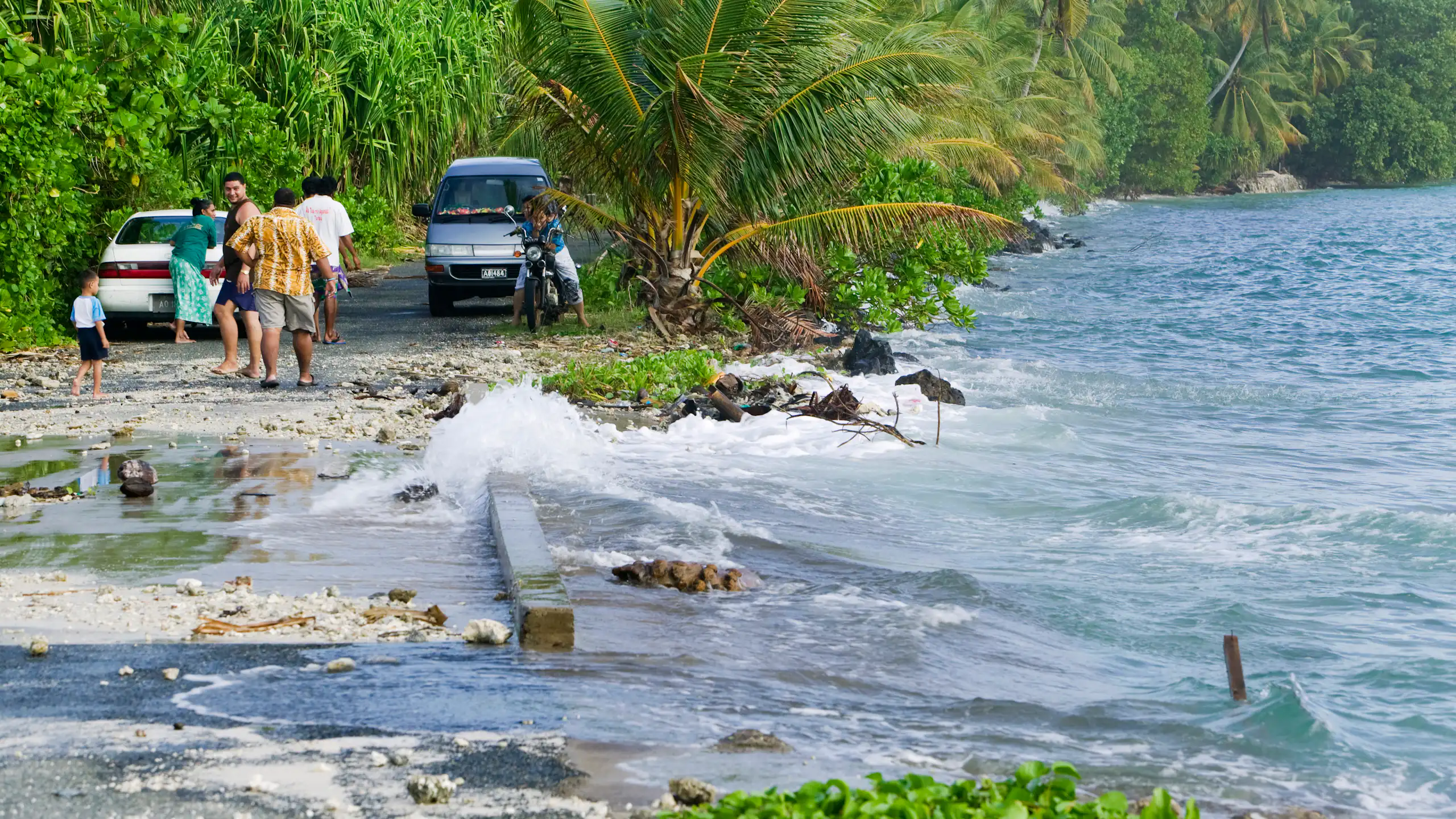 Tuvaluans watch as the high tide inundates their island home on funafuti due to global warming.