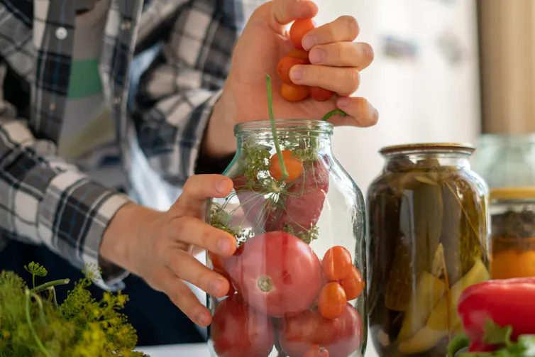 Man preserving vegetables