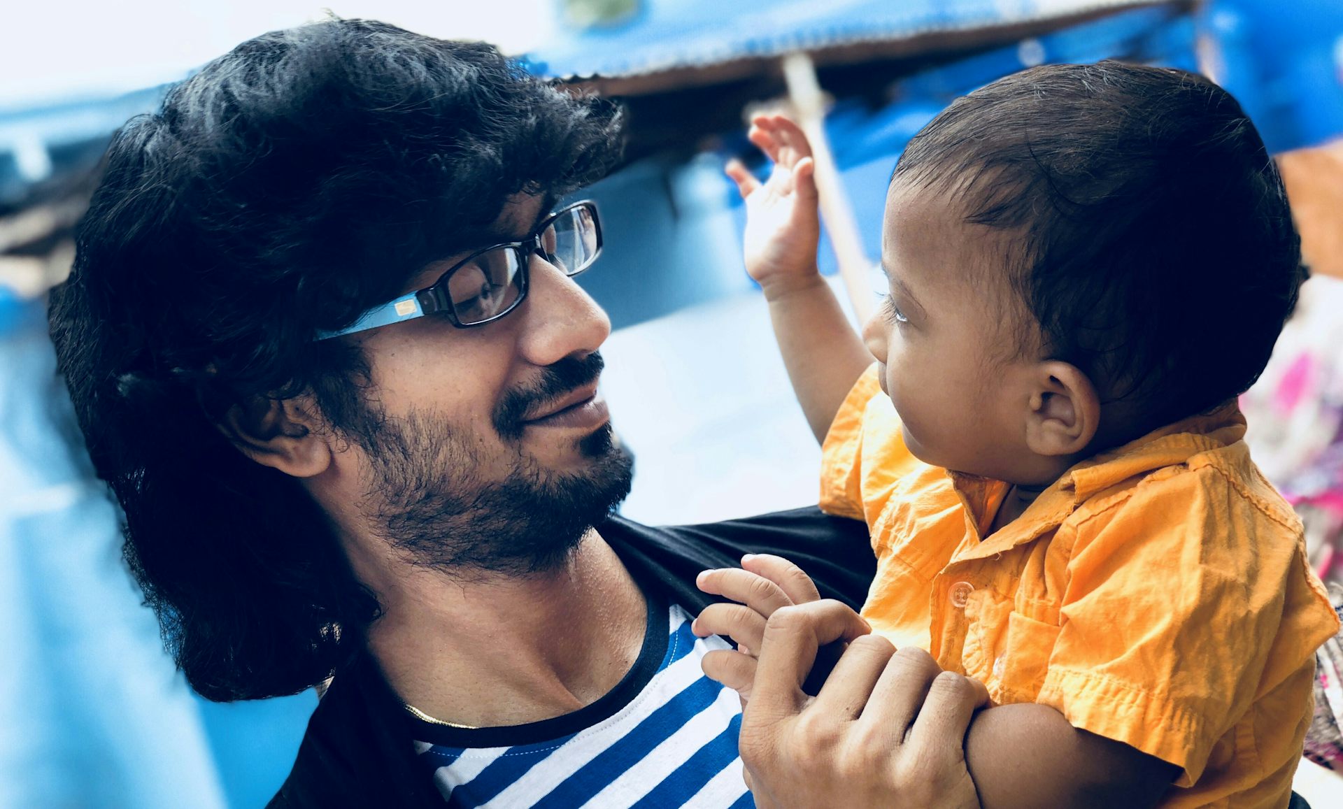 A father seen looking at his toddler.