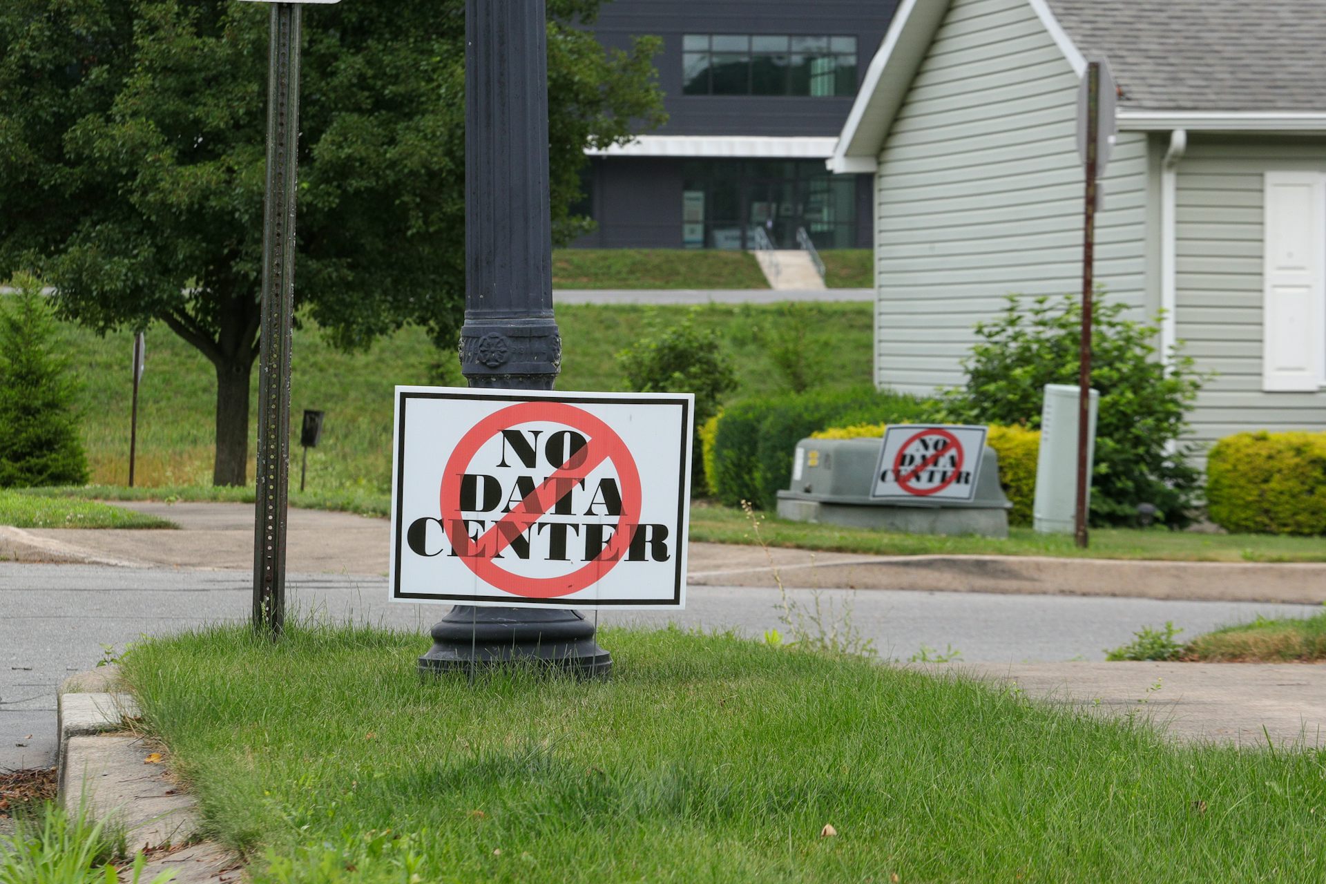 A lawn sign in suburban area says 'No Data Center'