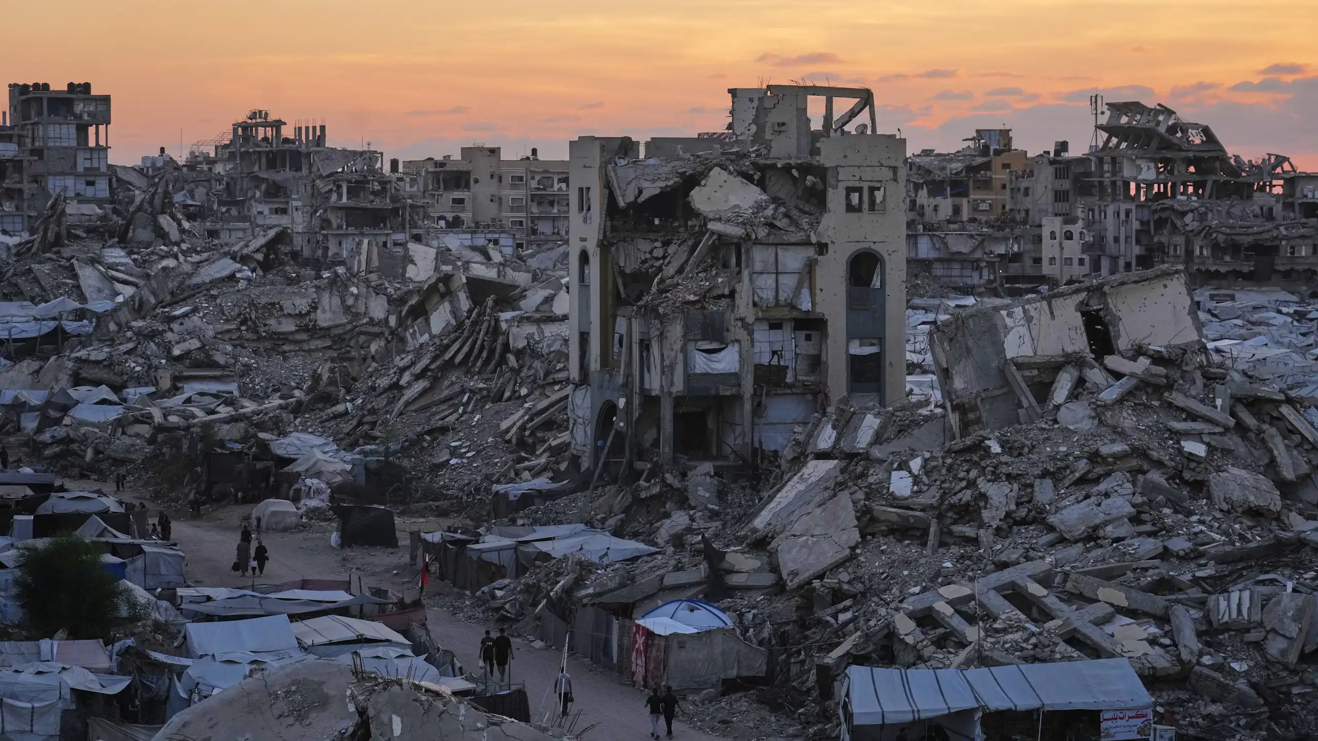 View of destroyed buildings and rubble-strewn street