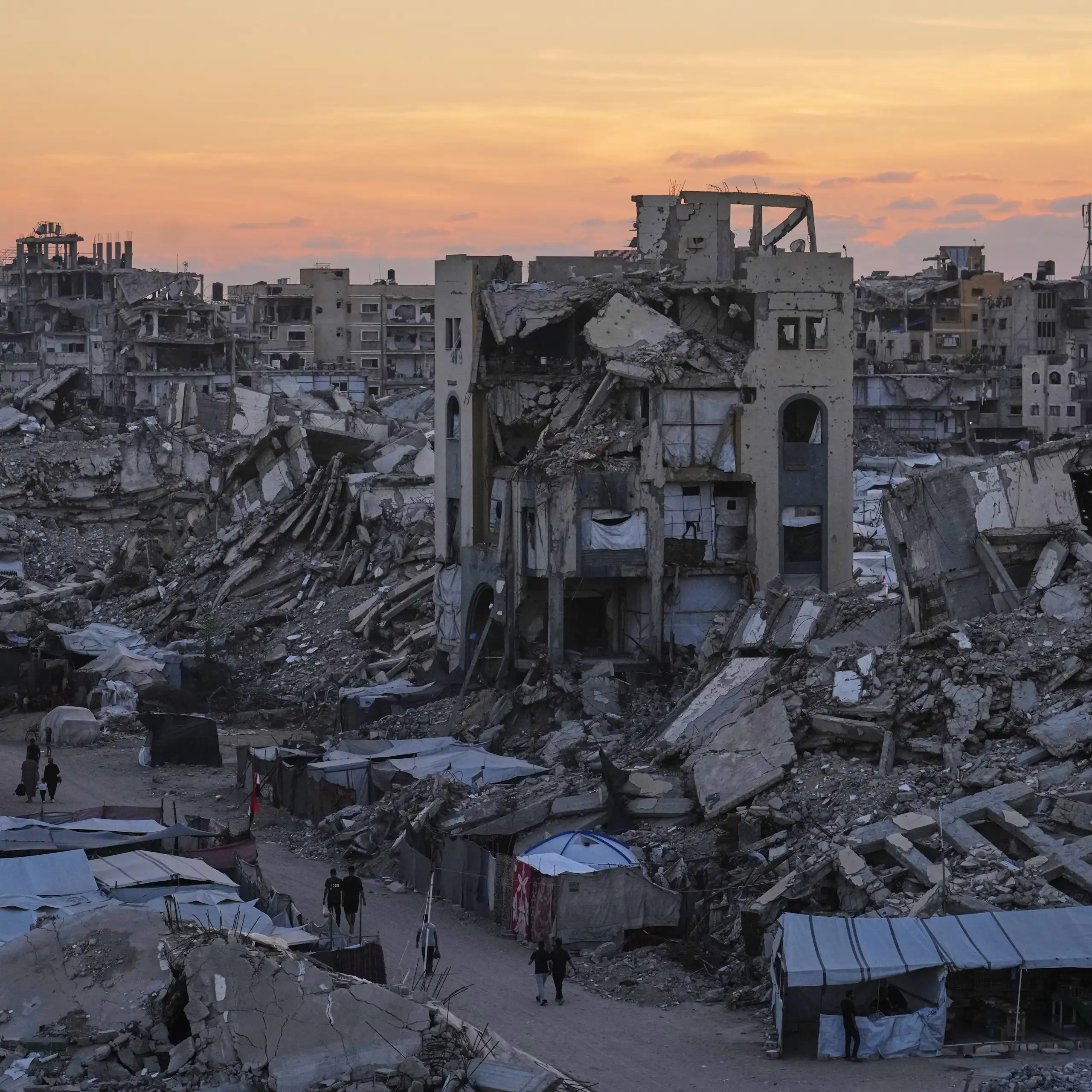 View of destroyed buildings and rubble-strewn street