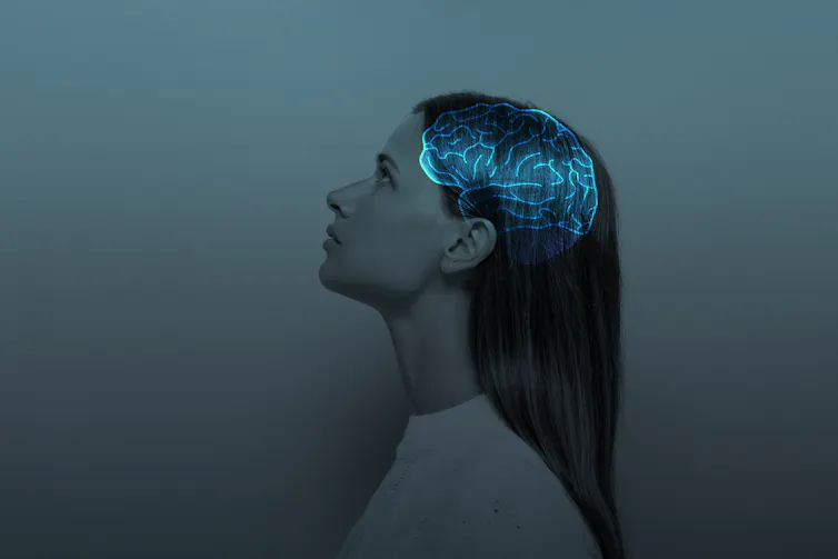 Image of woman from profile view overlayed with glowing brain
