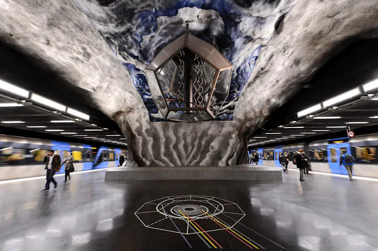 An artwork at a subway stations with various colours and patterns.