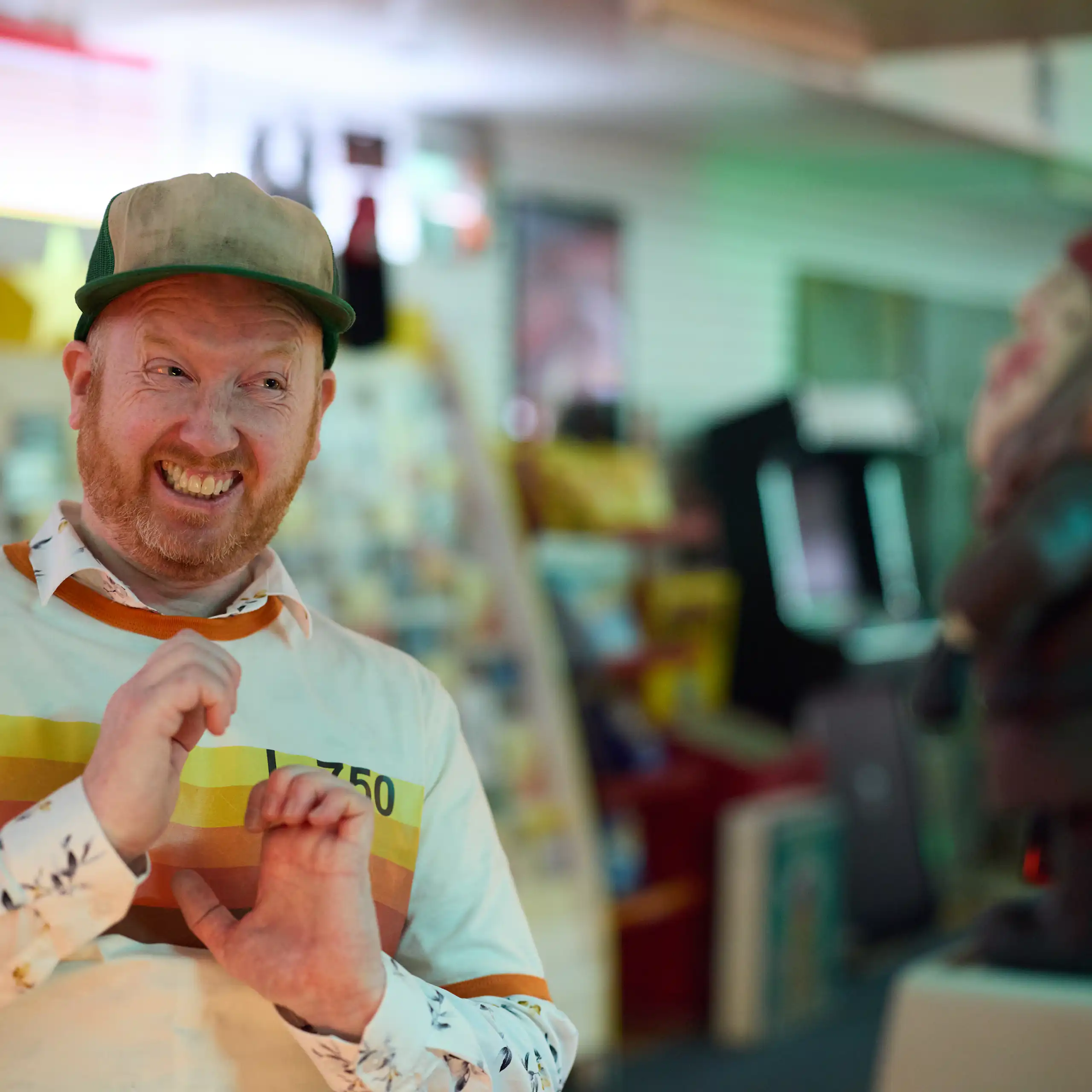 Luke McGregor pulls an awkward face at a gnome.