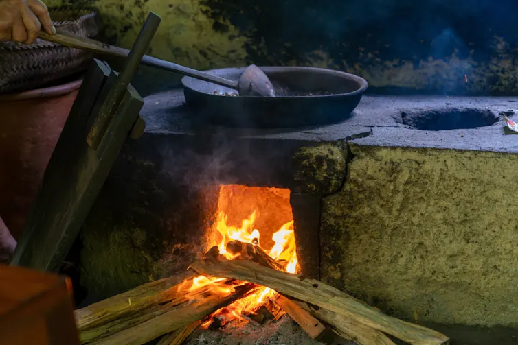 A cooker using wood as a fuel source.