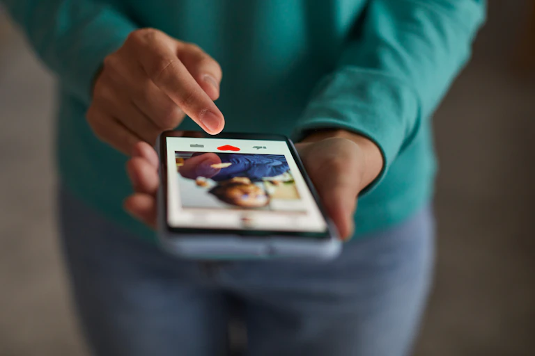 An Afro American woman using dating app on her smartphone