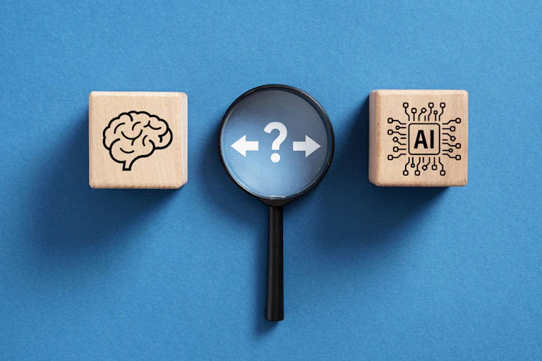 A question mark hesitates between a human brain and an artificial intelligence chip