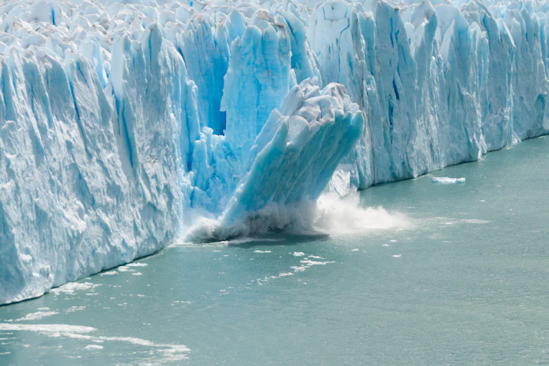 Glacier calving into water