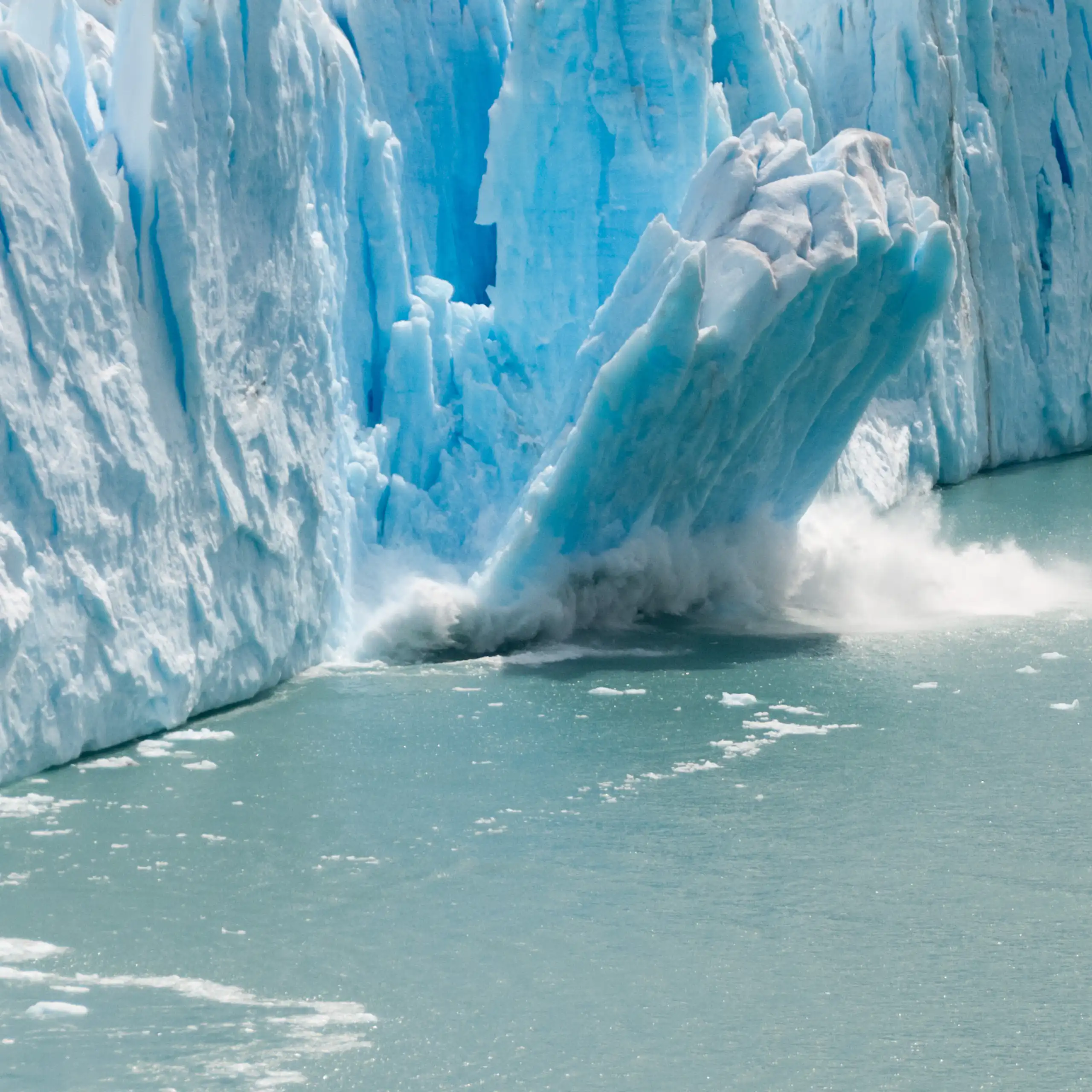 Glacier calving into water