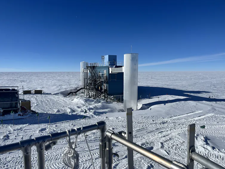 A built structure against blue sky and snowy ground as far as visible.
