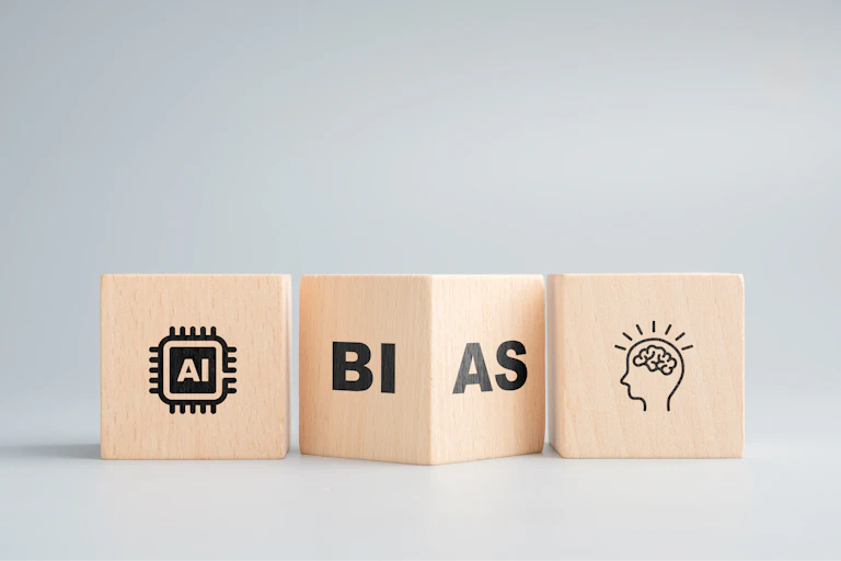 thrree wooden blocks with letters and line drawings on a surface