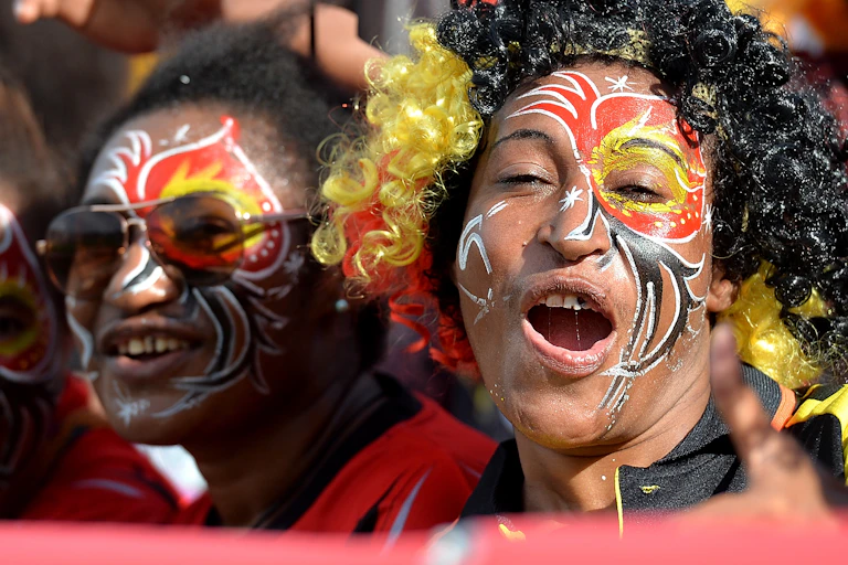 Three PNG women show their support during the 2017 rugby league World Cup.