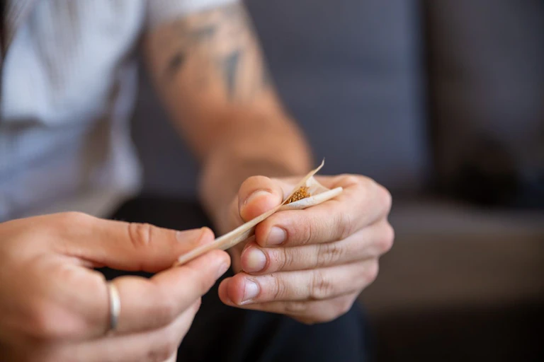 Person rolling a joint