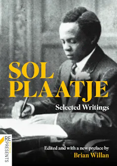 A book cover with a vintage photograph of a smartly dressed African man at a desk, writing.