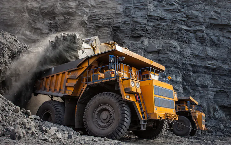 Coal being loaded into a truck at a quarry.