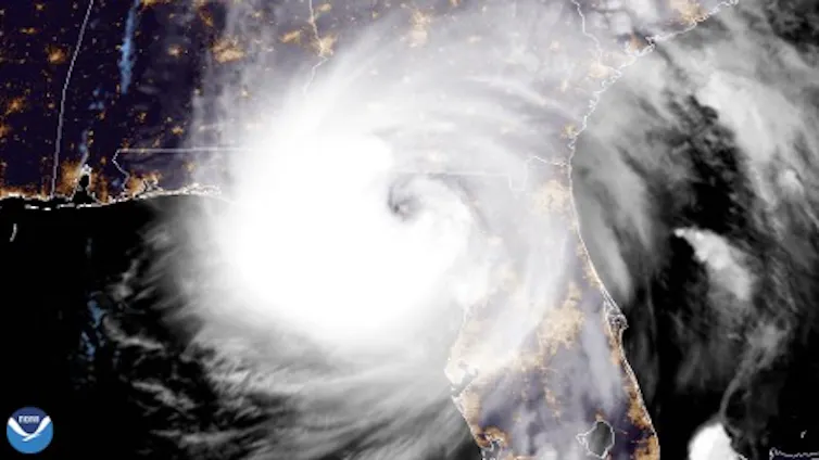 A satellite image of a very large Hurricane Helene hitting the Florida Gulf coast.