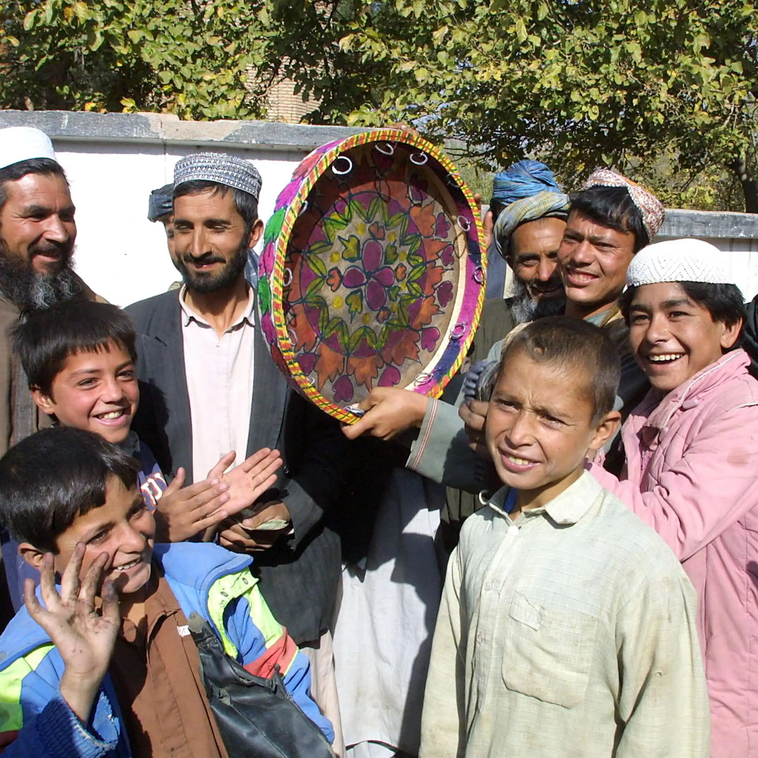 People in Afghanistan dance during a celebration after the Taliban's fall in 2001.