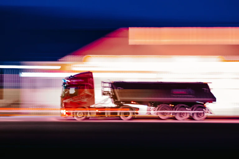 A blurred image of a speeding truck