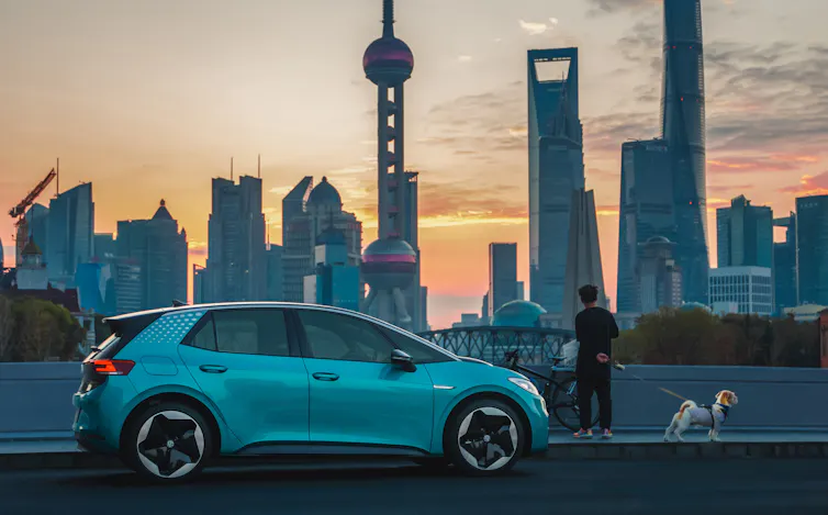 Electric car with Shanghai skyline