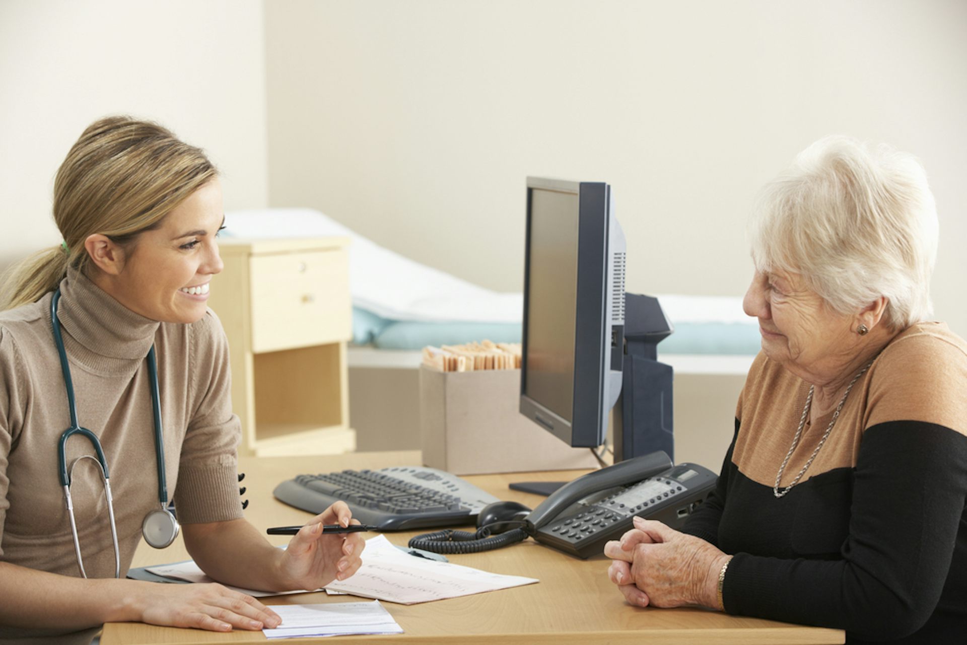 A woman talking to her GP.