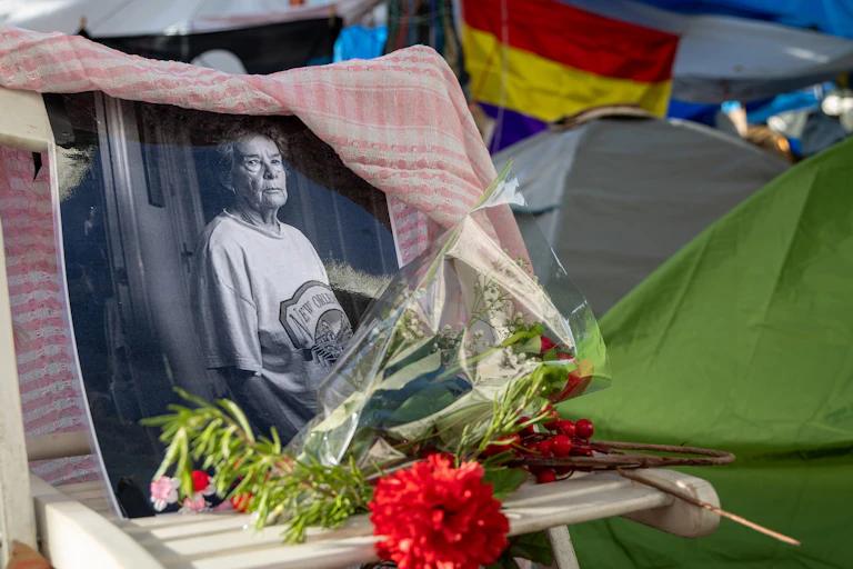 A small memorial to Maricarmen Abascal stands at the housing camp in the Puerta del Sol in Madrid, Spain