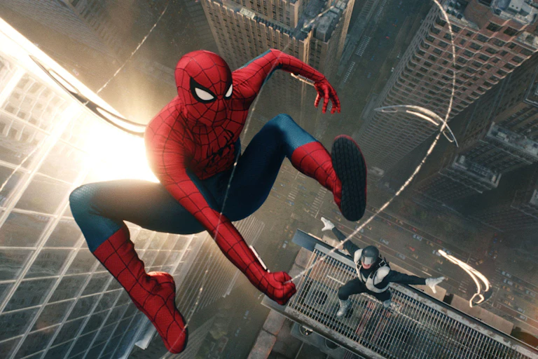 An image of Spider-Man leaping between buildings with a baddie in pursuit.