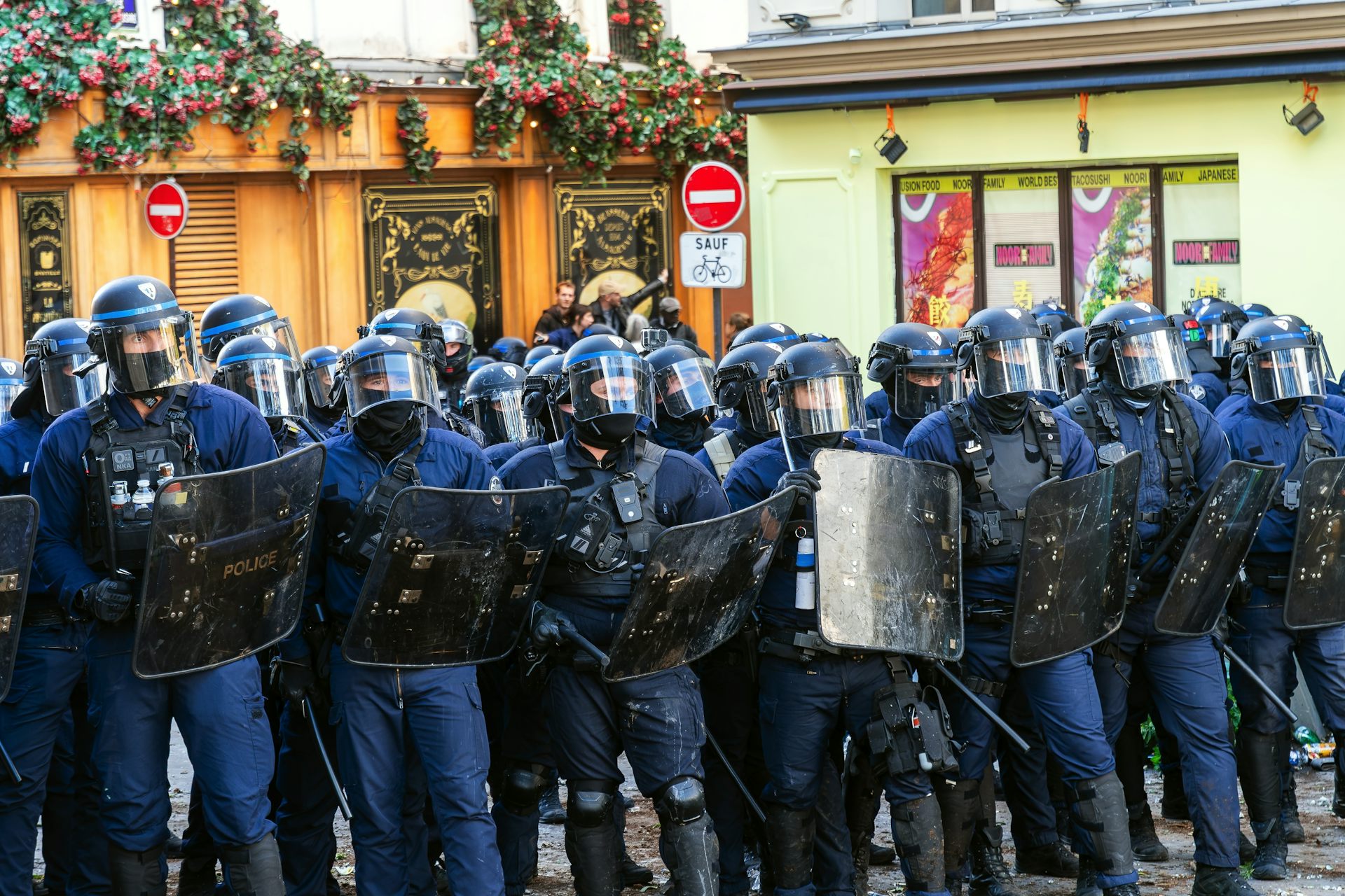 Line of police in riot gear