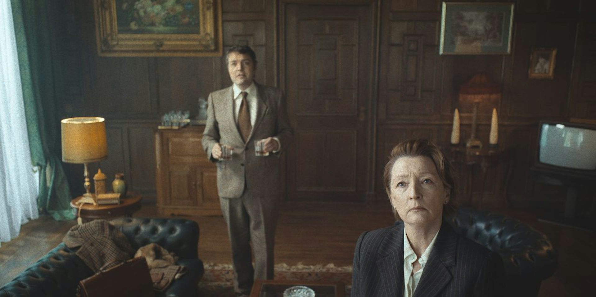 Two academics in a very English wood panelled office