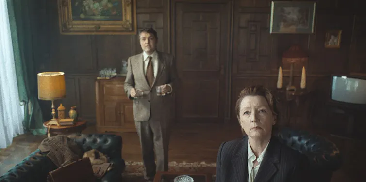Two academics in a very English wood panelled office
