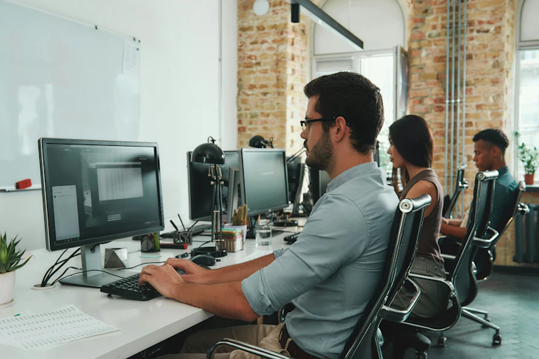 People in an office working on computers