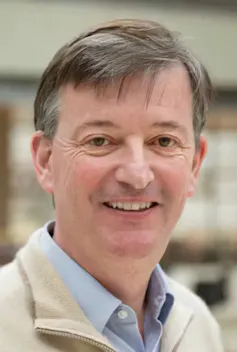 A photograph of Nicholas Polson's face.