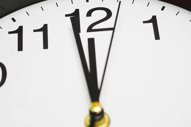 Clock hands to midnight