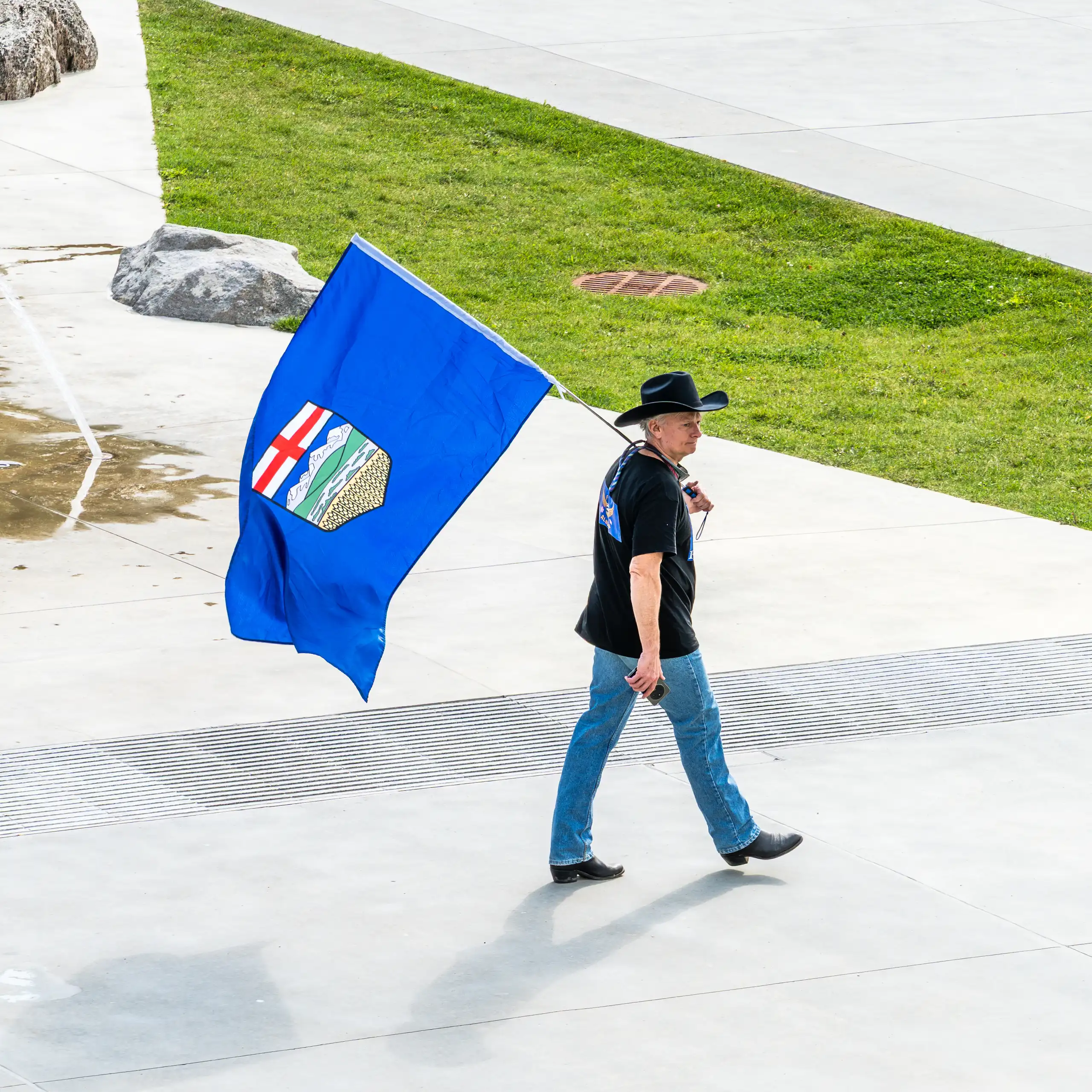 A separatist supporter with an Alberta flag.