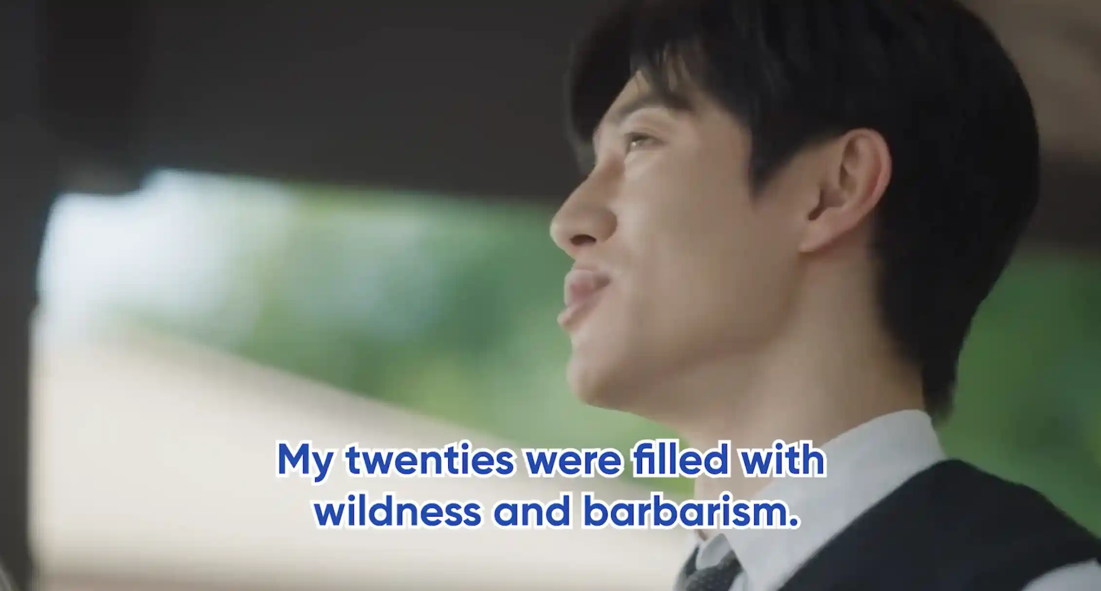 A young Korean man in profile, with words reading My twenties were filled with wildness and barbarism.