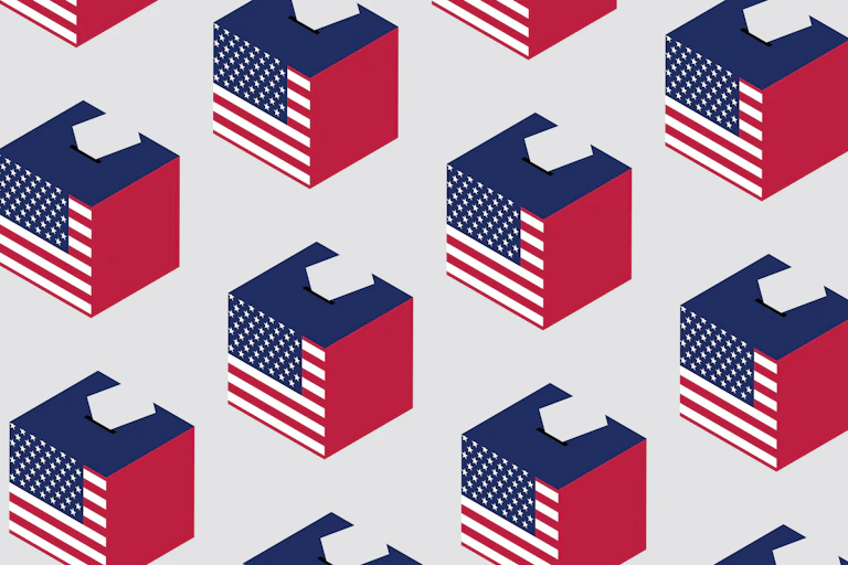 Ballot boxes covered in American flags.
