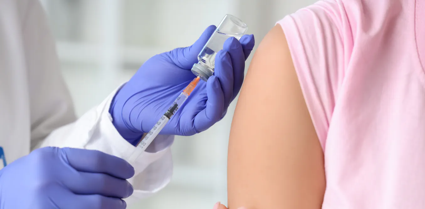 Photo: theconversation.com Spain Debates Combined or Separate Flu and COVID-19 Vaccination