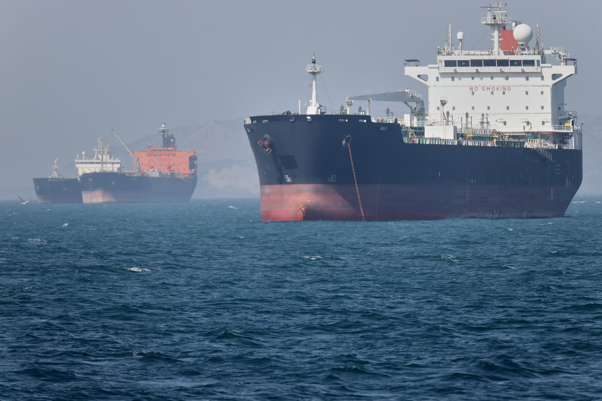 Two oil tankers sit at anchor offshore in the Strait of Hormuz off Bandar Abbas, Iran, May 2, 2026.