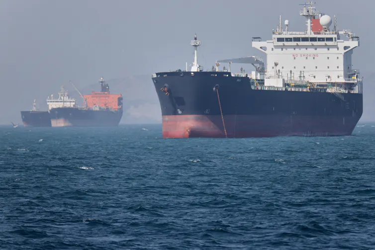 Two oil tankers sit at anchor offshore in the Strait of Hormuz off Bandar Abbas, Iran, May 2, 2026.