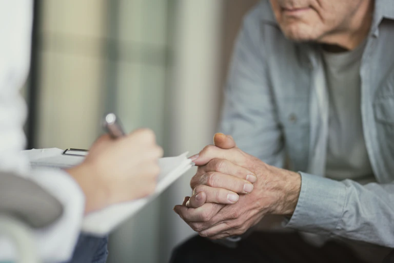 A veteran answers questions from a health-care provider