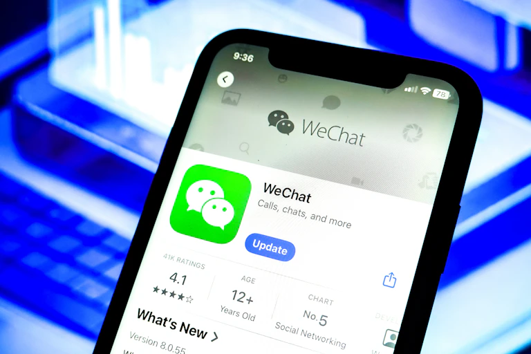 A smartphone with an app store download screen for WeChat