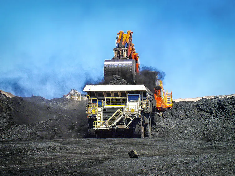 A coal truck being loaded in an open-cut coal mine.