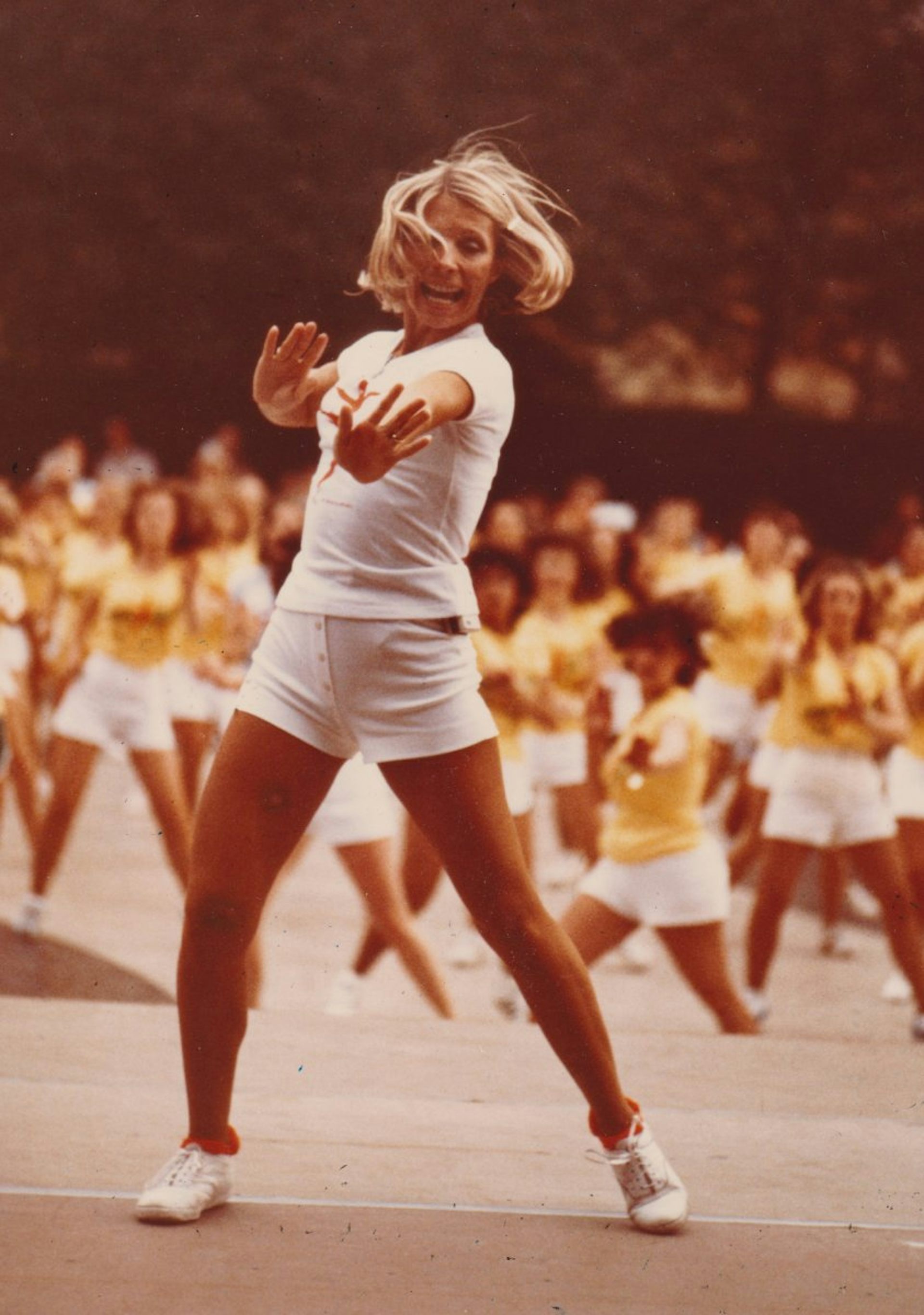 Jacki Sorensen leading an aerobics dance class at an event.