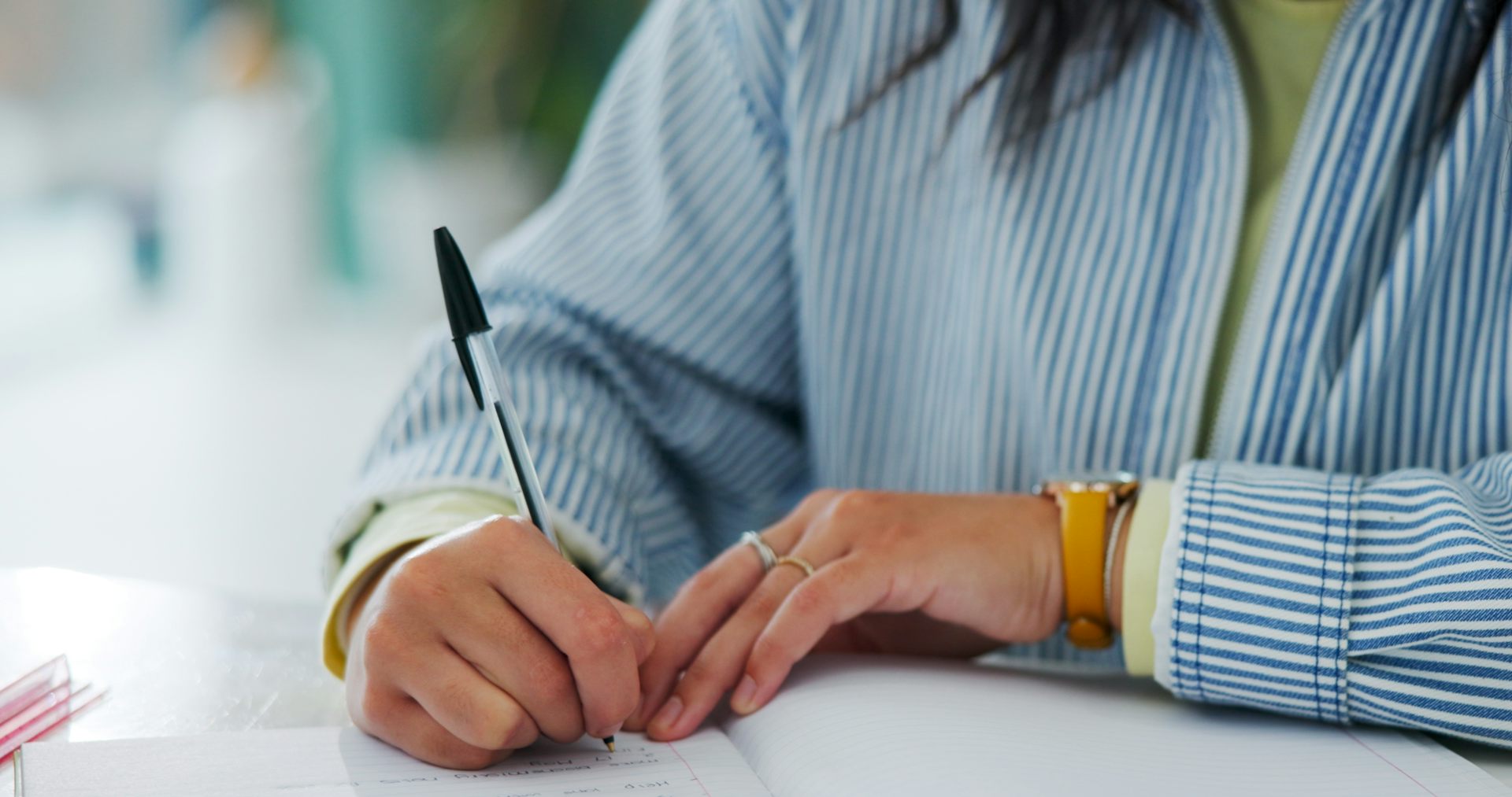 Woman writing with pen