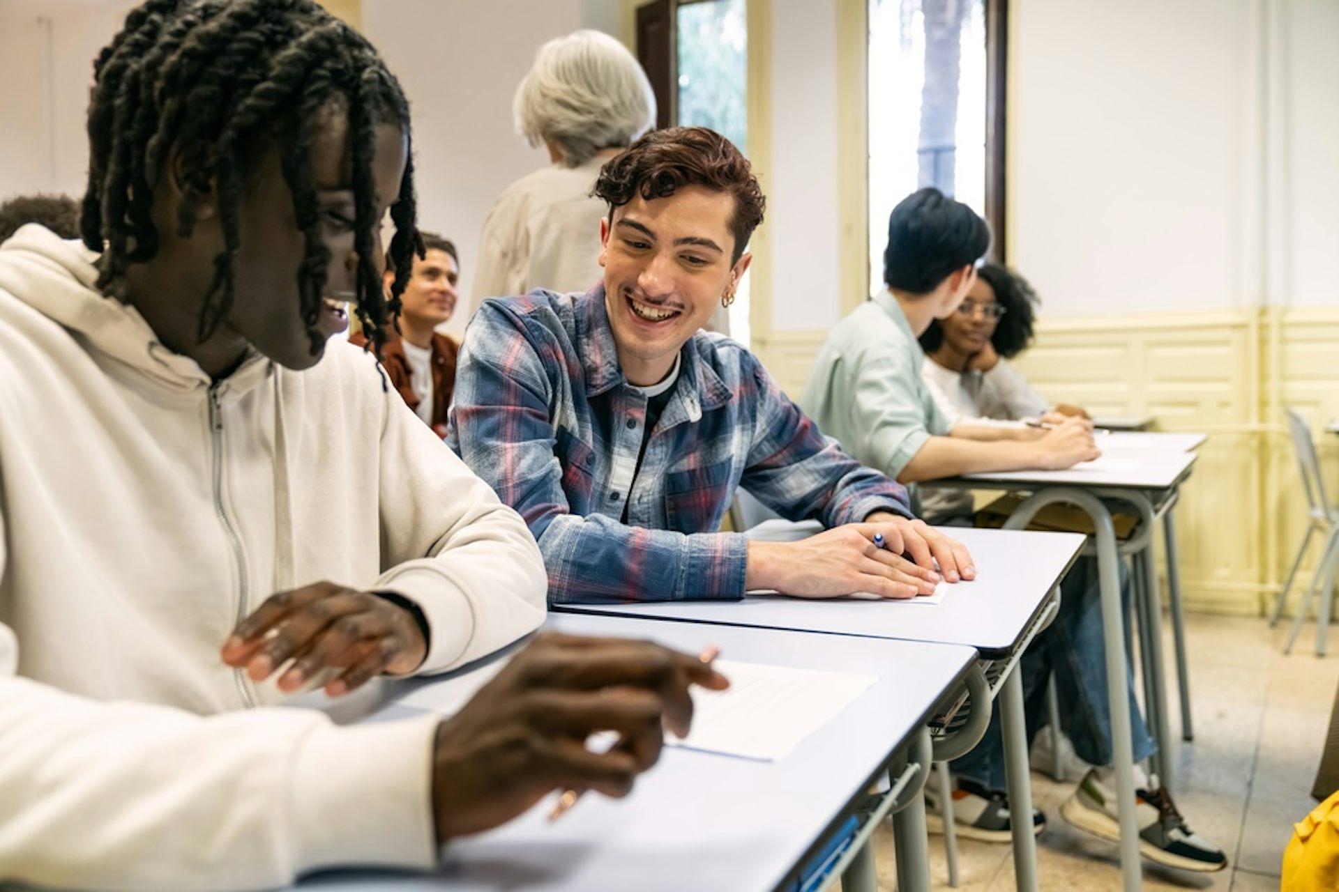 Two students talking and smiling