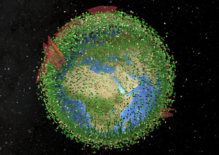 Imagen de la Tierra centrada en África y Europa cubierta por satélites representados en color verde