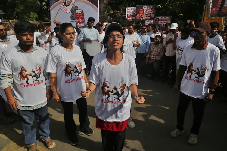 Protestors on street in India calling for education minister to resign