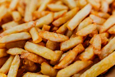 a pile of frozen french fries